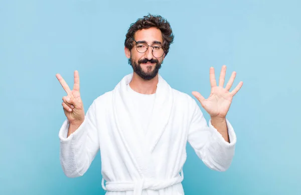 Young Bearded Man Wearing Bath Robe Smiling Looking Friendly Showing — Stock Photo, Image