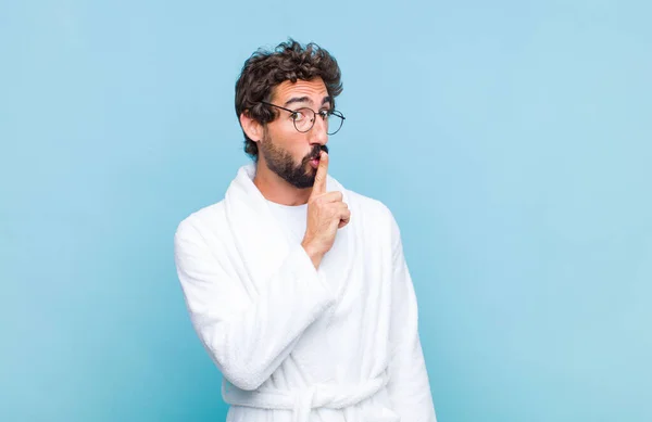 Young Bearded Man Wearing Bath Robe Asking Silence Quiet Gesturing — Stock Photo, Image