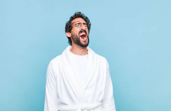 Young Bearded Man Wearing Bath Robe Screaming Furiously Shouting Aggressively — Stock Photo, Image