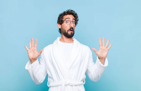 Young Bearded Man Wearing Bath Robe Feeling Stupefied Scared Fearing — Stock Photo, Image