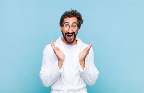 Young Bearded Man Wearing Bath Robe Feeling Shocked Excited Laughing — Stock Photo, Image