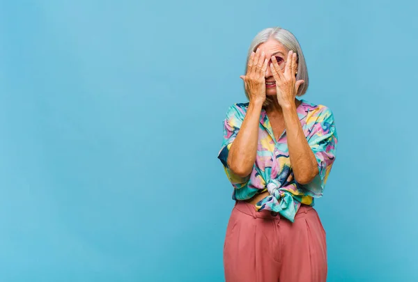 Middle Age Cool Woman Covering Face Hands Peeking Fingers Surprised — Stock Photo, Image
