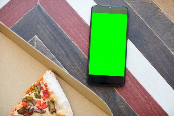 empty green screen smart mobile telephone . chroma key concept