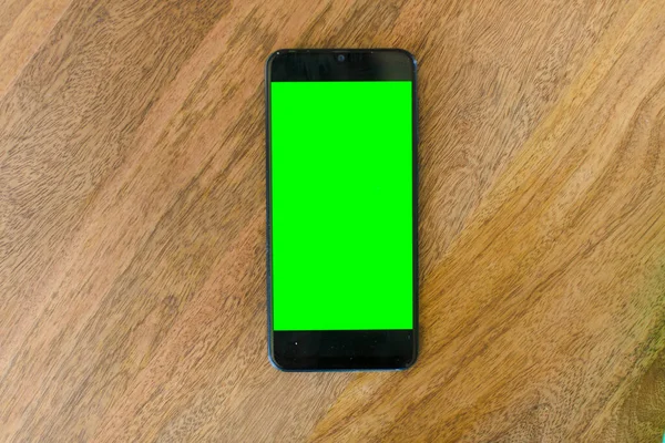 empty green screen smart mobile telephone . chroma key concept