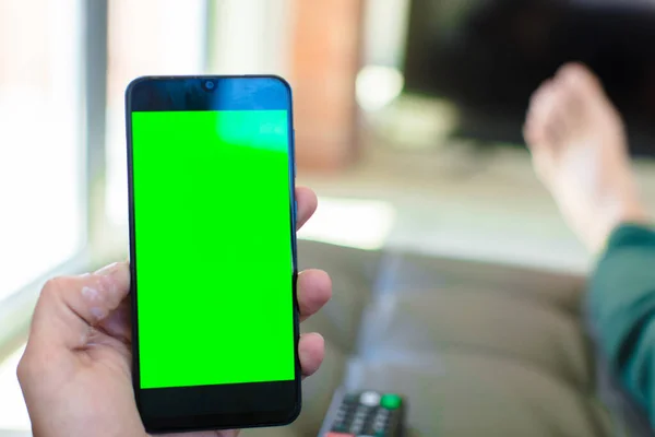 empty green screen smart mobile telephone . chroma key concept