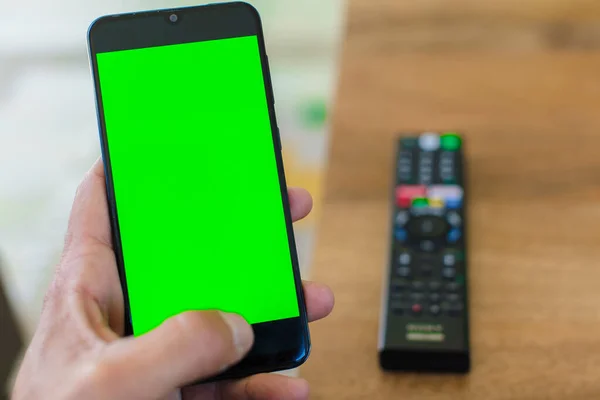 empty green screen smart mobile telephone . chroma key concept