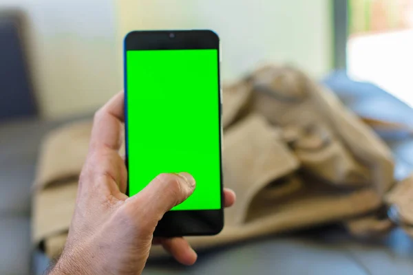 empty green screen smart mobile telephone . chroma key concept