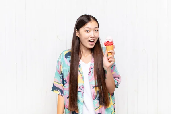 asian young woman with an ice cream. summer concept