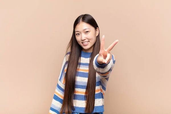 Asian Young Woman Smiling Looking Happy Carefree Positive Gesturing Victory — Stock Photo, Image