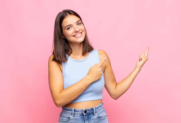 Young Pretty Woman Smiling Happily Pointing Side Upwards Both Hands — ストック写真