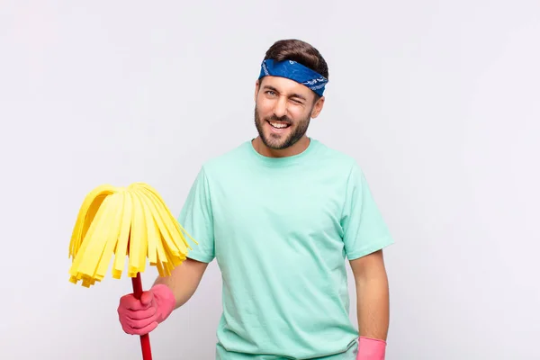 Jovem Olhando Feliz Amigável Sorrindo Piscando Olho Para Você Com — Fotografia de Stock