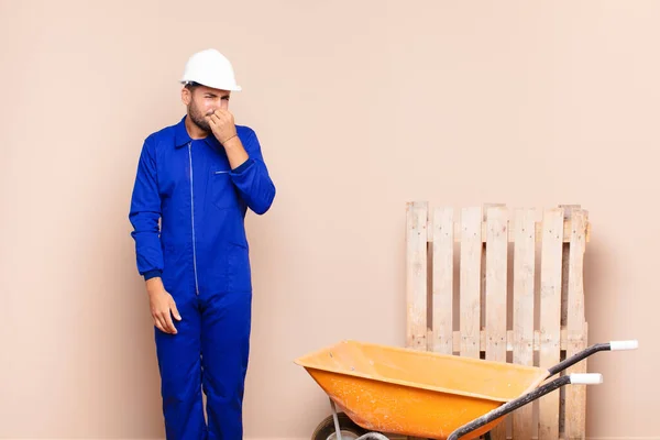 Young Man Feeling Disgusted Holding Nose Avoid Smelling Foul Unpleasant — Stock Photo, Image