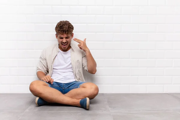 Young Man Looking Unhappy Stressed Suicide Gesture Making Gun Sign — Stock Photo, Image