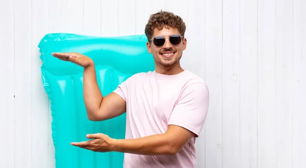 Young Man Smiling Feeling Happy Positive Satisfied Holding Showing Object — Stock Photo, Image