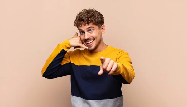 Young Man Smiling Cheerfully Pointing Camera While Making Call You — Stock Photo, Image