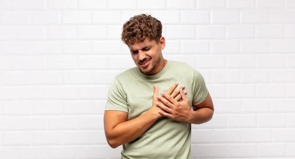 Young Man Looking Sad Hurt Heartbroken Holding Both Hands Close — Stock Photo, Image