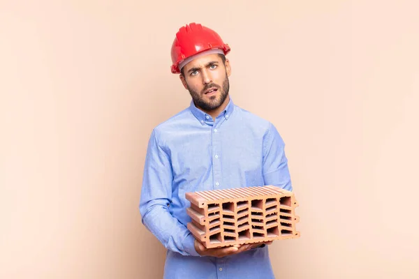 Young Man Feeling Puzzled Confused Dumb Stunned Expression Looking Something — Stok fotoğraf