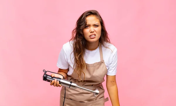 Young Woman Baker Feeling Puzzled Confused Dumb Stunned Expression Looking — Foto Stock