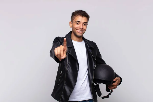 Young Motorbike Rider Smiling Proudly Confidently Making Number One Pose — Stockfoto