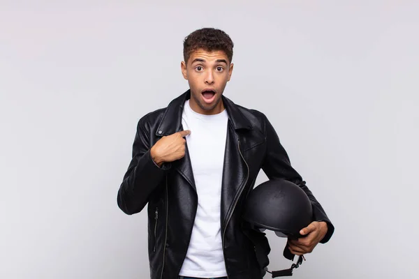 Young Motorbike Rider Looking Shocked Surprised Mouth Wide Open Pointing — Stok fotoğraf