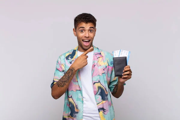 Young South American Man Looking Excited Surprised Pointing Side Upwards — Stock fotografie