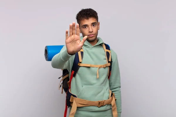 Young Hiker Man Looking Serious Stern Displeased Angry Showing Open — Fotografia de Stock