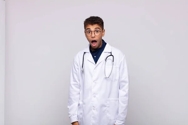 Young Physician Man Looking Very Shocked Surprised Staring Open Mouth — Stock Photo, Image