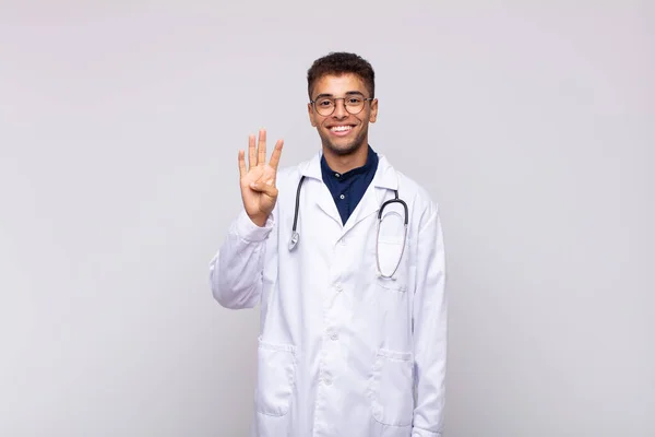 Young Physician Man Smiling Looking Friendly Showing Number Four Fourth — Φωτογραφία Αρχείου