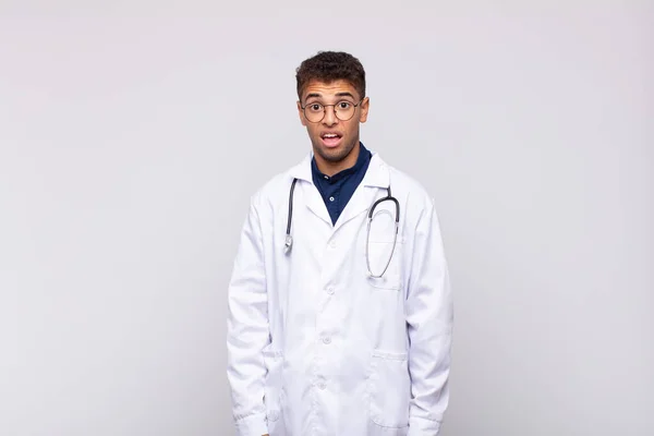 Young Physician Man Feeling Puzzled Confused Dumb Stunned Expression Looking — Fotografia de Stock