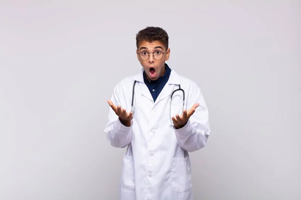 Young Physician Man Feeling Extremely Shocked Surprised Anxious Panicking Stressed — Φωτογραφία Αρχείου