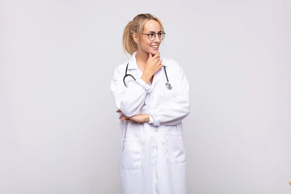 Young Woman Physician Smiling Happy Confident Expression Hand Chin Wondering — Stock Photo, Image