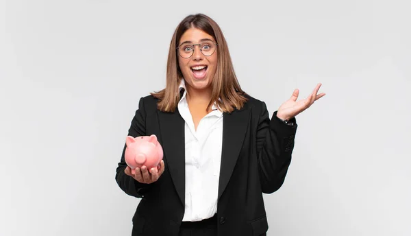 Young Woman Piggy Bank Feeling Happy Surprised Cheerful Smiling Positive — Zdjęcie stockowe