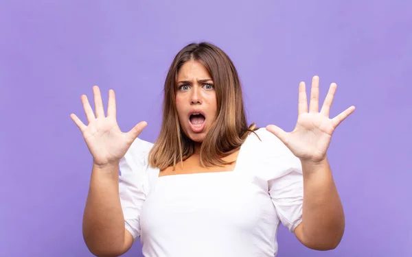 Young Blonde Woman Feeling Stupefied Scared Fearing Something Frightening Hands — Stock Photo, Image