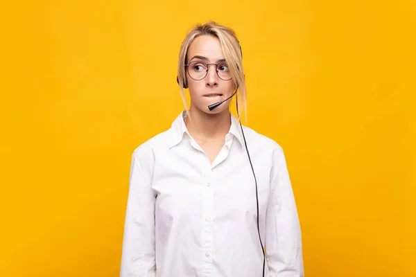 Young Woman Telemarketer Looking Puzzled Confused Biting Lip Nervous Gesture — Stock Photo, Image