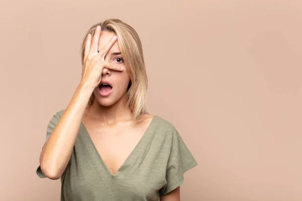 Woman Looking Shocked Scared Terrified Covering Face Hand Peeking Fingers — Stock Photo, Image
