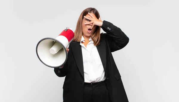 Young Woman Megaphone Looking Shocked Scared Terrified Covering Face Hand — Stok fotoğraf