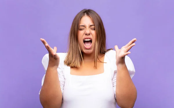 Young Blonde Woman Furiously Screaming Feeling Stressed Annoyed Hands Air — Stock Photo, Image