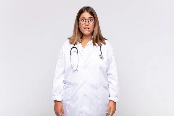 Young Woman Physician Looking Puzzled Confused Biting Lip Nervous Gesture — Stock fotografie