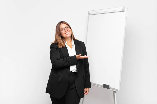 Woman Smiling Cheerfully Feeling Happy Showing Concept Copy Space Palm — Stock Photo, Image