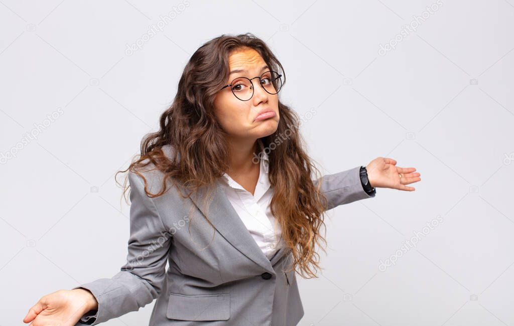 Woman feeling clueless and confused, having no idea, absolutely puzzled with a dumb or foolish look