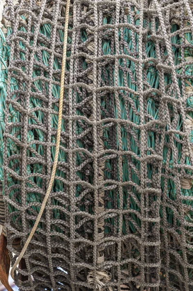 Net rolled up on drum aboard commercial fishing boat in New Bedford