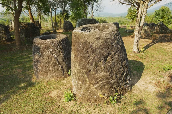 Ancient stone jars in a Plain of Jars (Site #3) near Phonsavan,  Xienghouang province, Laos. UNESCO World Heritage Site