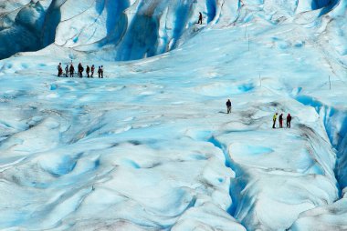 People hiking at the Jostedalsbreen glacier, the biggest glacier in continental Europe, located in Sogn og Fjordane county, Norway.  clipart