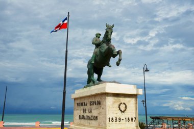 Puerto Plata, Dominican Republic - November 04, 2012: Equestrian statue to the general Gregorio Luperon in Puerto Plata, Dominican Republic. Luperon was the 20th President of the Dominican Republic. clipart