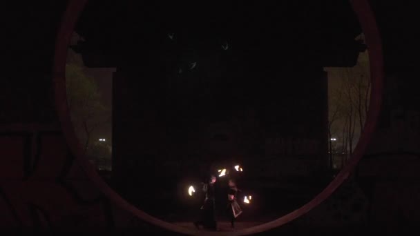 Led and diode performance of the two artists man and woman at the night. — Stock Video