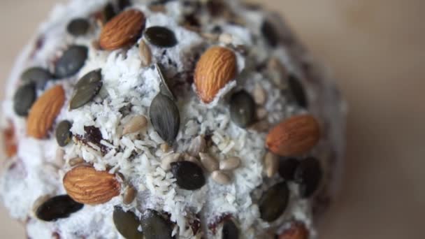 Macro shot of Top of easter with Pumpkin seeds and almonds. — Stock Video