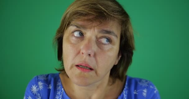 4k - An adult lady with a serious expression on her face thinks about something — Stock Video