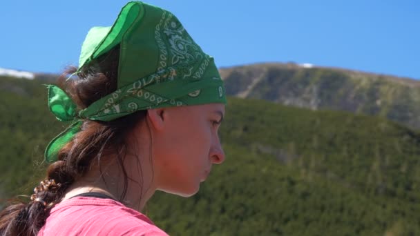 Young woman with a plaid in a green hanky in the Carpathians in slo-mo — 비디오