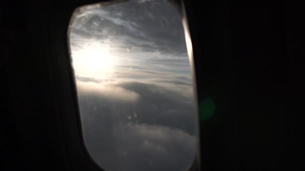 Aerial shot of clouds soaring like a huge mat under sparkling sun — Stock Video