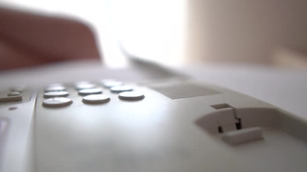 The girl hangs down the white phone landline in slow motion — Stock Video